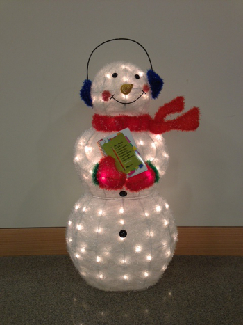 Snowman with a book