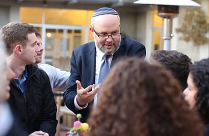 Professor Kenneth Bamberger, director of the Berkeley Institute for Jewish Law and Israel Studies, meets with students during a conference break.