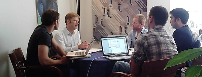 Berkeley Law alum Christopher Driscoll ’11 and Haas alum Robert Basterfield ’11 consult with co-founders of Hooktheory