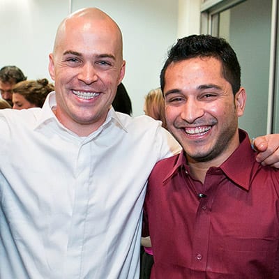 Adrian Kinsella '15 and Mohammad celebrate the later's safe arrival in the U.S. at a Berkeley Law party in Jan. 2014. Photo by Bruce Cook.