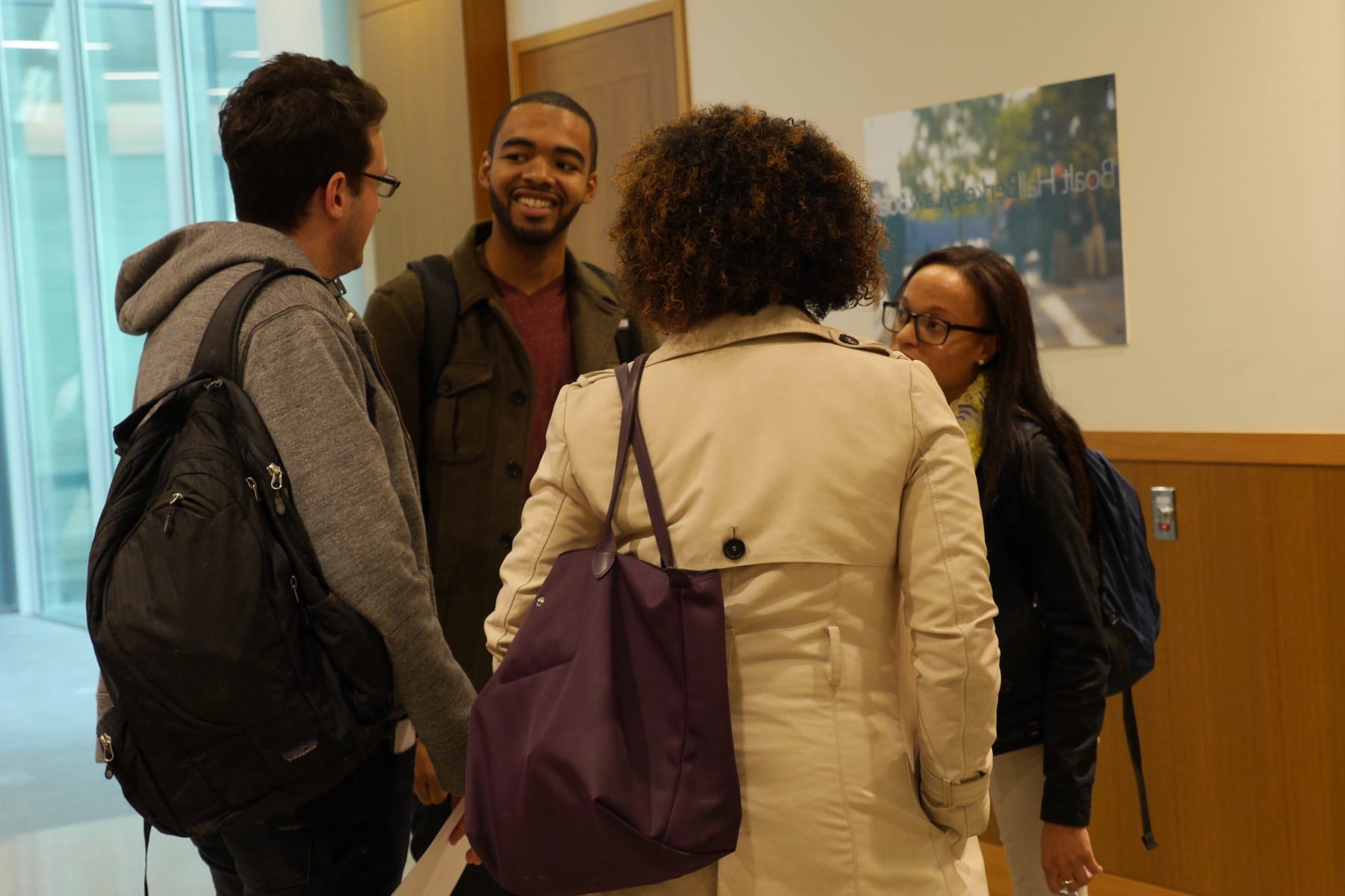 Image of Berkeley Law Students chatting in Berkeley Law hallway