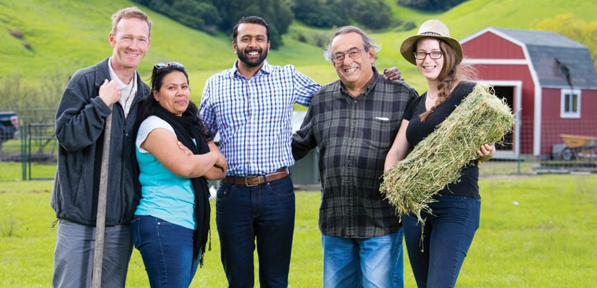 GREENER PASTURES: GC3 founding director Sushil Jacob ’11 (center) with members of the New Hope Farms Cooperative, which the clinic helped form.