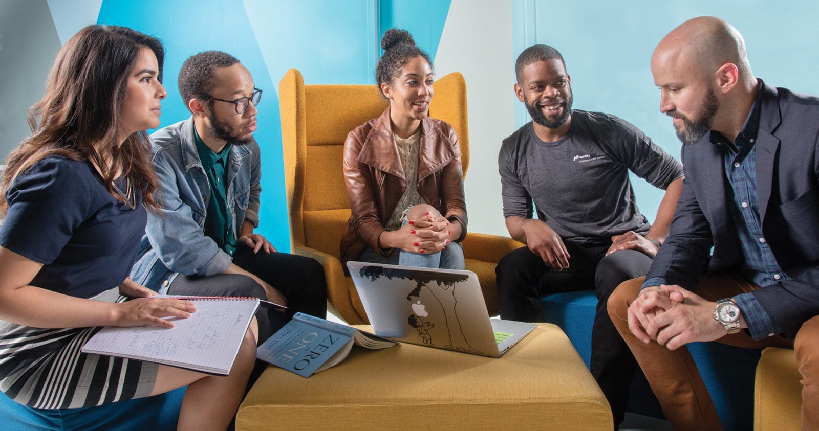 People sitting around a table meeting.