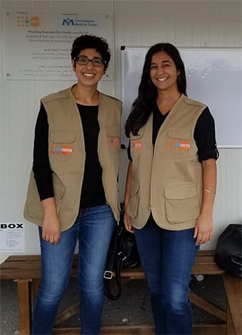 Julie Freccero (right) and her colleague Saba at the Scaramanga refugee camp, outside of Athens.