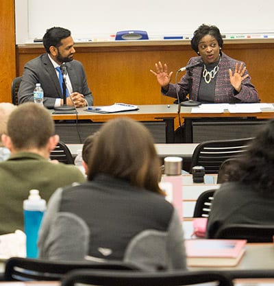 Clyburn discusses her concerns with Professor Tejas Narechania (left) and Berkeley Law students. 