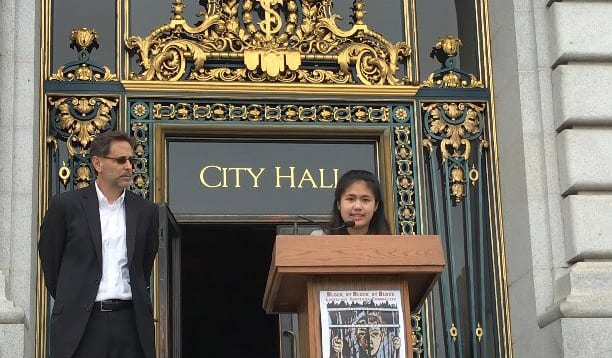 Jeff Selbin and Shelby Nacino at the podium at City Hall