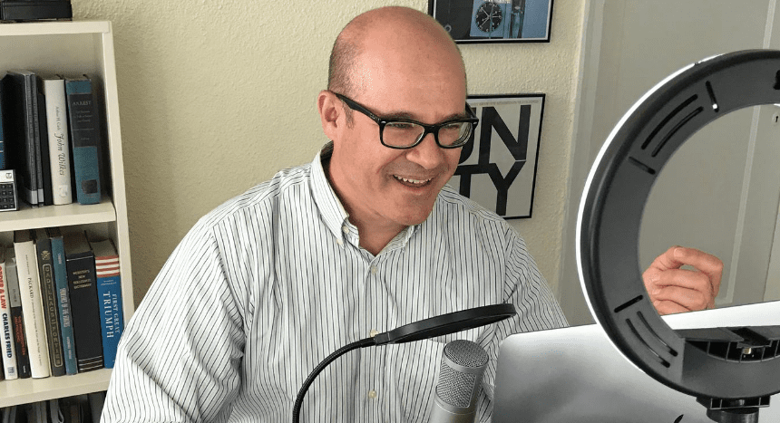 Professor Orin Kerr in front of a microphone and computer