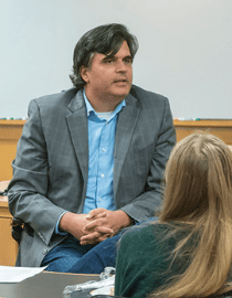 seth davis in a classroom with students