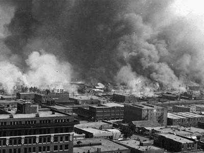 aerial shot of burning city
