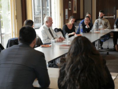 man speaking at lunch meeting