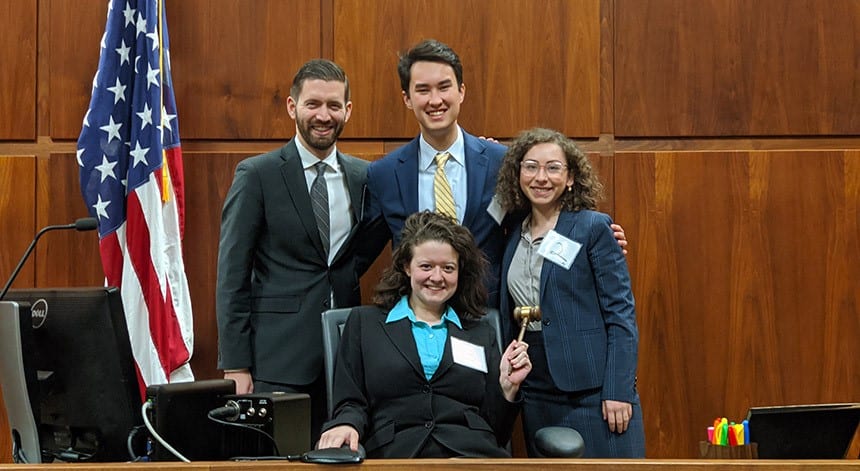students sitting at a trial podium