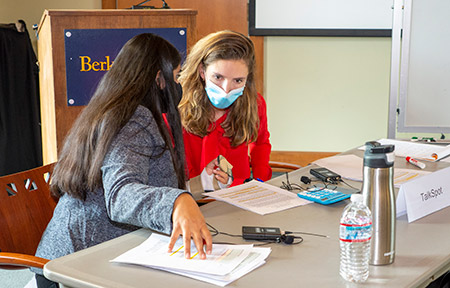 Freydrich (right) confers with her teammate Bhatla. 