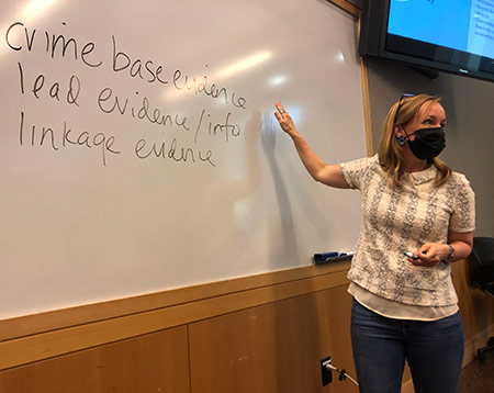 Alexa Koenig at whiteboard teaching