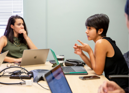 woman teaching to student