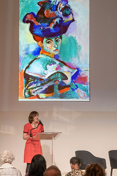 Adine Varah with Claude Monet’s “Femme au Chapeau" painting