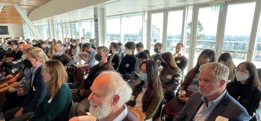 group of people listening to a speaker