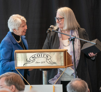 uc berkeley chancellor carol christ and deanna ruth rutter at podium