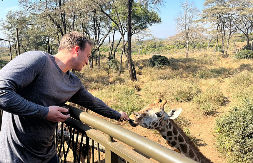 Brock Williams with giraffe