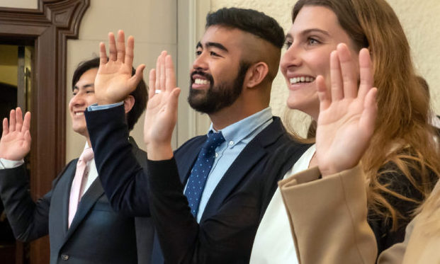 Lawyers raising their hands for swearing in oath
