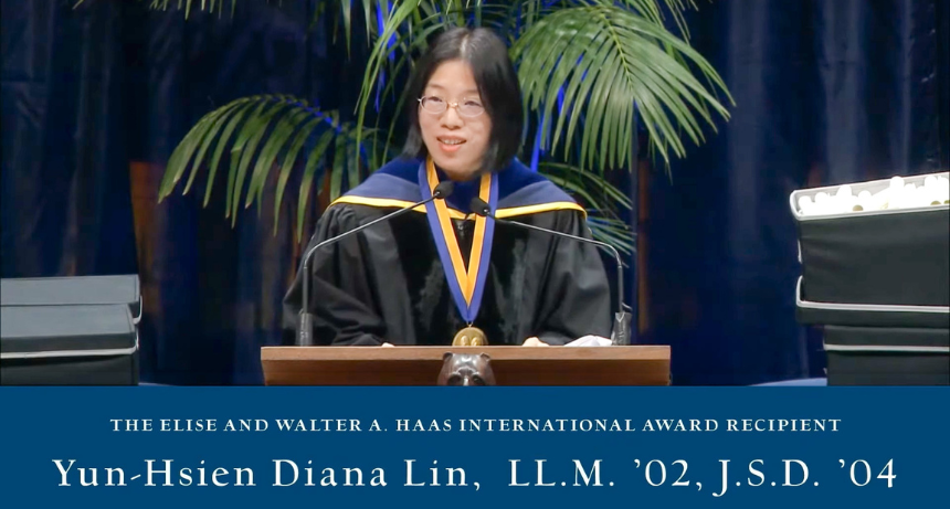 Law Professor Yun-Hsien Diana Lin in regalia standing at podium