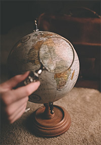 Globe with magnifying glass