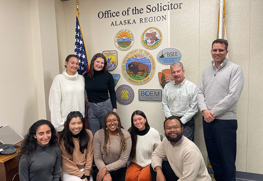 Students under the Solicitor General sign