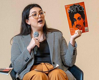 Samantha Cox holds up picture of Prince