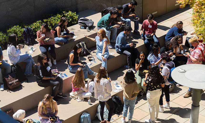 Crowd of students eating lunch on outside steps