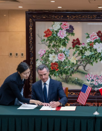 woman and man at signing ceremony