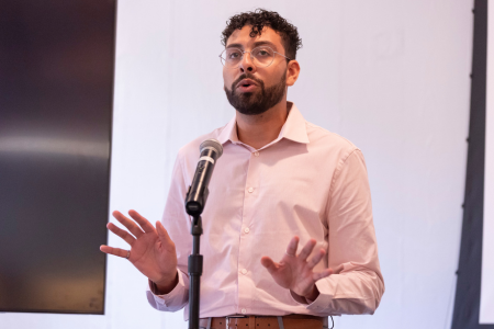 man talking at podium