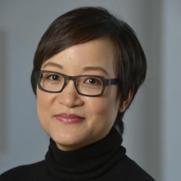 Picture of Ruth Chang wearing glasses and a black turtleneck.