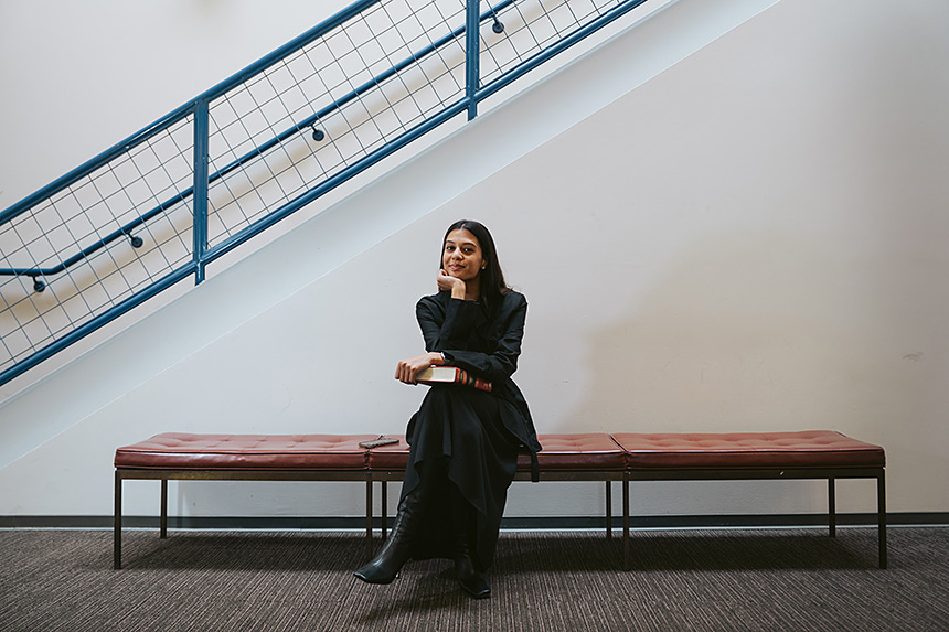 Insia Zaidi sitting on bench