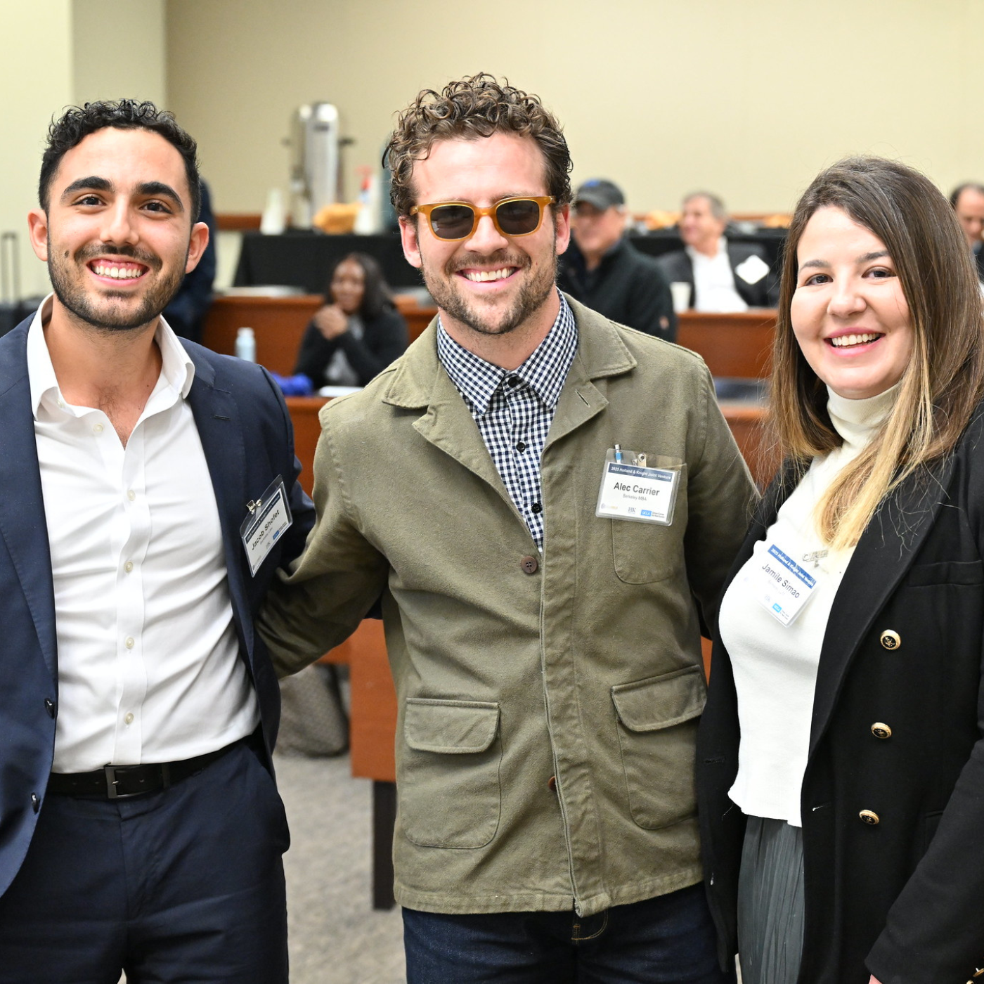 image of Jacob Shofet, Alec Carrier, and Jamile Simao smiling and posing together