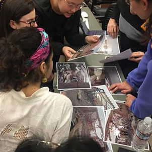 Students looking at photographs