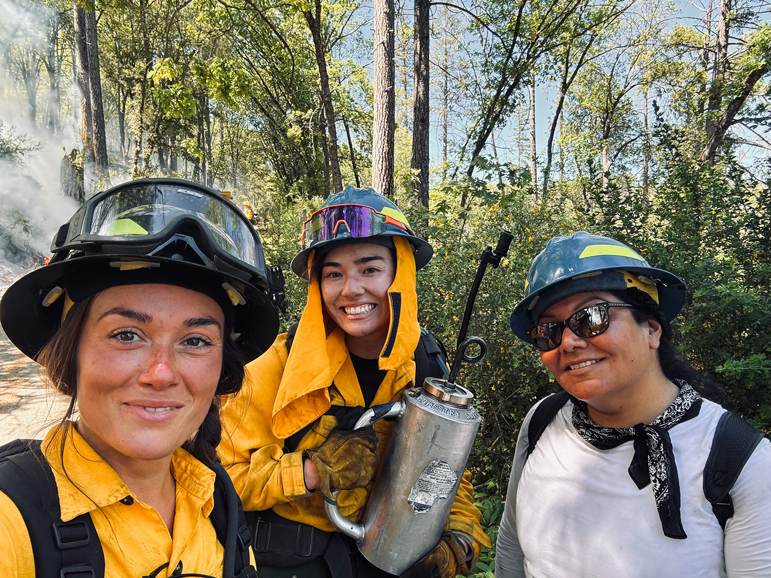 Michelle Cone with coworkers wearing gear outside