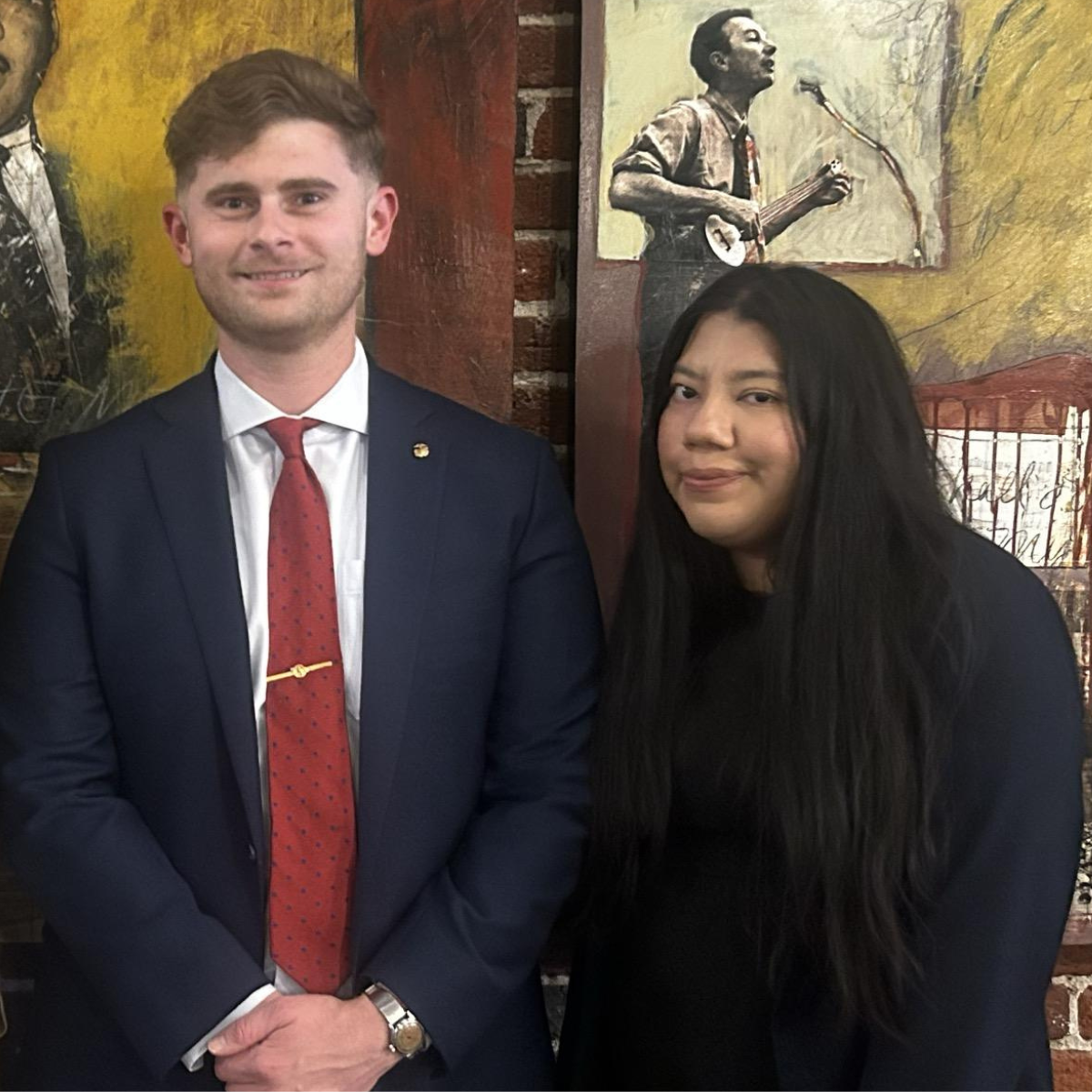 a man and a woman in business clothes